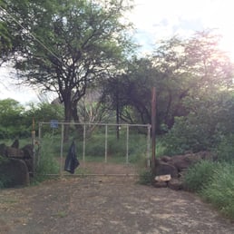 Trail head is behind this fence, to the left Trail head is behind this fence, to the left