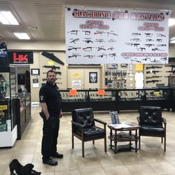 Hawkeye Shooting Academy - Manager, Brent Martin with his assistant Charlie standing in the store, ready to help you!