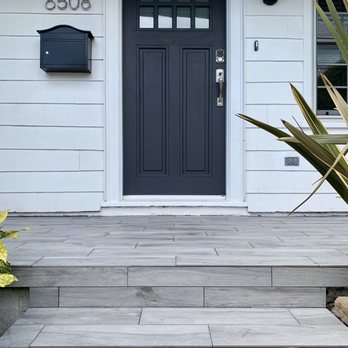 Sosa Remodeling & Construction - Finished wood-look porcelain tile front porch. - General Contractors Near Me Sosa Remodeling & Construction - Finished wood-look porcelain tile front porch. - General Contractors Near Me