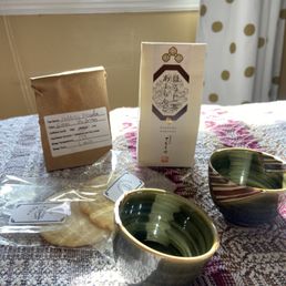 Cookies, tea, cups, and chocolate almonds Cookies, tea, cups, and chocolate almonds