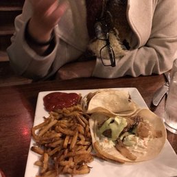Tacos with guacamole sauce and fries Tacos with guacamole sauce and fries