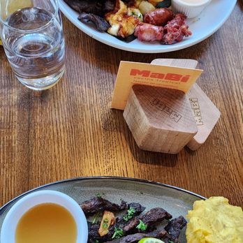 MaBi Tropical - Bandeja MaBi (top) and Carne Salada. - Latin American Near Me - Charlotte, North Carolina MaBi Tropical - Bandeja MaBi (top) and Carne Salada. - Latin American Near Me - Charlotte, North Carolina