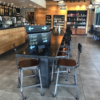 Starbucks - a view of a coffee shop with tables and stools - Coffee & Tea Near Me - Newark, California