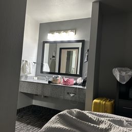 The sink is outside of the bathroom. The sink is outside of the bathroom.