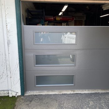 Central Valley Overhead Door - 'Bronze colored' g-door progress.. house gets painted later...new driveways, too..God willing! - Garage Door Services Near Me - Fresno, California