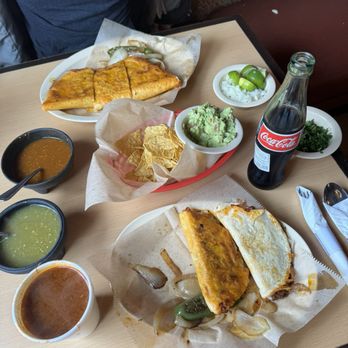 Yuri’s Taqueria - Quesabirria, two birria tacos with cheese (one soft, one crispy), chips and guacamole, consommé - Tacos Near Me - San Leandro, California Yuri’s Taqueria - Quesabirria, two birria tacos with cheese (one soft, one crispy), chips and guacamole, consommé - Tacos Near Me - San Leandro, California