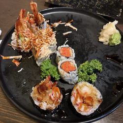 Izumi Japanese Cuisine - The end of a Spicy Crunchy Tuna roll, Angry Dragon Roll, Tempura Crab Meat Roll.