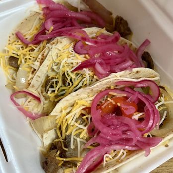 Caliente Mexican - two tacos in a styrofoam container - Mexican Near Me - Kingston, Rhode Island Caliente Mexican - two tacos in a styrofoam container - Mexican Near Me - Kingston, Rhode Island