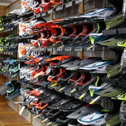 Davis Service Center - A wall of off-road helmets