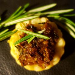 Indulge Catering - Delicious mushroom tartlet with fresh rosemary.
