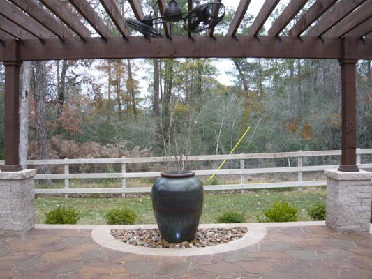 Cedar Pergola and Belgard Paver Patio - Custom built open rafter cedar pergola with Belgard Mega Arbel patio, Celtik stone for column bases and soldier course, and water pot fountain. Cedar Pergola and Belgard Paver Patio - Custom built open rafter cedar pergola with Belgard Mega Arbel patio, Celtik stone for column bases and soldier course, and water pot fountain.