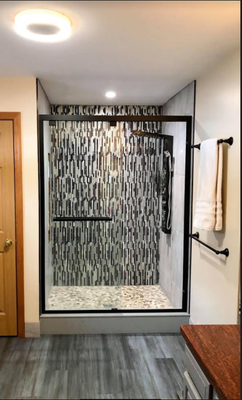 Bathroom Remodel - This shower was done by Doug the owner. The shower has a waterfall and rain effect feature. It lights up blue and tells you the temperature. It also has bluetooth capability so you can have your phone connected and play music while you're in the shower. Give us a call for more details! Bathroom Remodel - This shower was done by Doug the owner. The shower has a waterfall and rain effect feature. It lights up blue and tells you the temperature. It also has bluetooth capability so you can have your phone connected and play music while you're in the shower. Give us a call for more details!