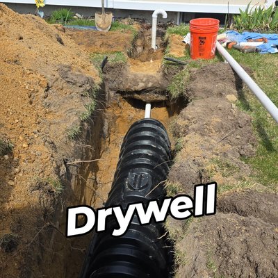 Drywell installation - This drywell installation was a replacement of an old 50 gallon oil drum that this customers laundry was discharging into. we got rid of that and installed a real dry well that will save this customer much time in between Cesspool services.