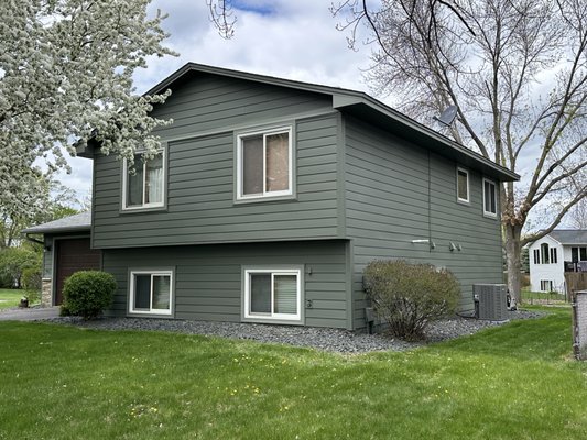 Composite Siding Installation - This exterior remodel was taking a dated home and redefining it's curb appeal. Adding accents, defining trim placement, and color matching the gutters, soffit, and fascia to create a seamless custom siding design. Using premium products like Alside Ascend Composite Siding in Deep Moss. Composite Siding Installation - This exterior remodel was taking a dated home and redefining it's curb appeal. Adding accents, defining trim placement, and color matching the gutters, soffit, and fascia to create a seamless custom siding design. Using premium products like Alside Ascend Composite Siding in Deep Moss.