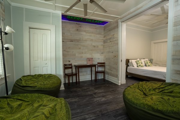 Green Room - The Green Room is a one bedroom, one bathroom, fully serviced apartment located in the Heart of Downtown Gainesville and close to everything! This cannabis themed apartment is fully furnished with a complete luxury kitchen, cozy cannabis themed CordaRoy's bean bags and covered porch that looks out into our courtyard.