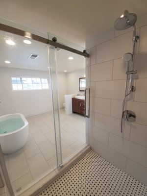 Burbank Bathroom Remodel - This remodel was done on a bathroom that had an old school look. Our client chose to renovate to something more modern. The choice of the tile and the huge shower with the frameless sliding door makes this bathroom a very spacious bathroom.