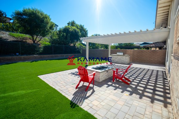 Rancho Mission Viejo - Full Backyard Remodel - Transformative outdoor living space featuring a durable Alumawood patio cover, low-maintenance artificial turf, stylish pavers and a cozy fire pit. Rancho Mission Viejo - Full Backyard Remodel - Transformative outdoor living space featuring a durable Alumawood patio cover, low-maintenance artificial turf, stylish pavers and a cozy fire pit.