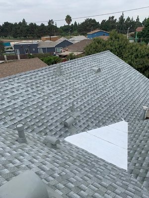 Shingle Roof Replacement in Los Angeles, CA - Are you considering a new roof for your home in Los Angeles? Shingle roofing is an excellent choice for the unique climate and lifestyle of our area. Here are some key benefits of shingle roofing in LA:

Durability and Longevity: Shingle roofs are designed to withstand the varied weather conditions in Los Angeles, including intense sunlight and occasional rain. With proper maintenance, they can last for decades.

Cost-Effective: Shingles are a budget-friendly roofing option that offers great value. Their affordability makes them a popular choice for homeowners looking to balance quality and cost.

Versatility and Aesthetic Appeal: Shingles come in a wide range of colors and styles, allowing you to customize the look of your home. Whether you prefer a classic or modern design, there's a shingle style to match your taste.

Energy Efficiency: Modern shingle roofing options include reflective coatings that help reduce heat absorption, potentially lowering your cooling costs during LA's hot summers.

Easy Installation and Maintenance: Shingle roofing is relatively easy to install, and repairs or replacements can be done quickly and efficiently. This means less disruption to your daily life.

Enhanced Protection: Shingles offer excellent protection against UV rays and wind, which helps maintain the integrity of your home and keeps it safe from the elements.

At [Your Company Name], we’re here to help you explore the benefits of shingle roofing and find the perfect solution for your home. Contact us today for a free, no-obligation quote and let our experienced team guide you through every step of the process.