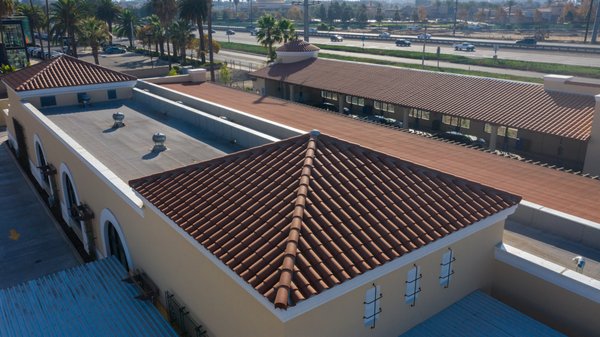 Car Wash Clay Tile Roof - We are proud to show you all another successfully completed roof at a Camarillo car wash! What you see here is a 2 piece clay tile roof system on a sloped area and modified torched down to the flat areas. The perfect roof for this type of building and adds a Spanish feel overall Car Wash Clay Tile Roof - We are proud to show you all another successfully completed roof at a Camarillo car wash! What you see here is a 2 piece clay tile roof system on a sloped area and modified torched down to the flat areas. The perfect roof for this type of building and adds a Spanish feel overall
