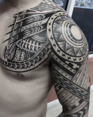 Polynesian & Tribal Tattoos - This style covers a range of Pacific Island cultures and traditions; there are distinct variations between styles and manners of tattooing among the islands. For example, Kakau tattoos are traditional to Hawaii, and the Tatau is traditional to Samoa. We have the best Polynesian and tribal tattoo artists that can recreate these traditional styles with the highest level of respect and adherence to the cultures they represent. These are more than a series of patterns and designs. Polynesian and tribal tattoos carry meaning and history. It is our pleasure to help you express yourself and your culture.
For those of you looking for the best Polynesian and tribal tattoo shop for a “tribal style” tattoo that reflects you’re appreciation of the culture, we also welcome you and are happy to discuss your ideas for your body art. Contact us today to learn more about this specialized style.
When it comes to the Best Polynesian and Tribal Tattoos in Miami, no one does it better than Fame Tattoos. We’ve helped many people get Polynesian and Tribal Tattoos they love, and no matter how simple or intricate the Tattoo you have in mind is, you can rest assured that we have the talent and the experience to make it a reality. Check out some of the Polynesian and Tribal Tattoos we’ve done in the past to see for yourself why we are the best in the business. Schedule your appointment with us online today. Polynesian & Tribal Tattoos - This style covers a range of Pacific Island cultures and traditions; there are distinct variations between styles and manners of tattooing among the islands. For example, Kakau tattoos are traditional to Hawaii, and the Tatau is traditional to Samoa. We have the best Polynesian and tribal tattoo artists that can recreate these traditional styles with the highest level of respect and adherence to the cultures they represent. These are more than a series of patterns and designs. Polynesian and tribal tattoos carry meaning and history. It is our pleasure to help you express yourself and your culture.
For those of you looking for the best Polynesian and tribal tattoo shop for a “tribal style” tattoo that reflects you’re appreciation of the culture, we also welcome you and are happy to discuss your ideas for your body art. Contact us today to learn more about this specialized style.
When it comes to the Best Polynesian and Tribal Tattoos in Miami, no one does it better than Fame Tattoos. We’ve helped many people get Polynesian and Tribal Tattoos they love, and no matter how simple or intricate the Tattoo you have in mind is, you can rest assured that we have the talent and the experience to make it a reality. Check out some of the Polynesian and Tribal Tattoos we’ve done in the past to see for yourself why we are the best in the business. Schedule your appointment with us online today.
