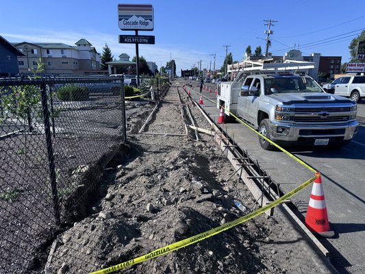 City sidewalk project in Tacoma WA - Commercial sidewalk replacement project in Tacoma completed per city plans. Existing concrete was removed and replaced with proper safety precautions in place, including cones, while working along a busy street.