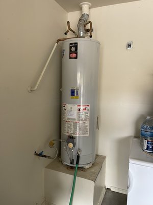 Gas water heater Installation - This is a gas water heater installation. All water heaters installed by Bradley Plumbing LLC come with new supply lines, a new ball valve, new copper pipe and fittings for the temperature and pressure relief line, and a new drain pan with drain line.