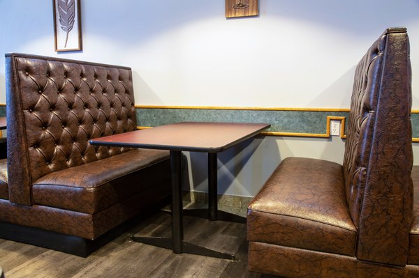 Family Fusion Diner - Family Fusion Diner is a popular restaurant where guests can relax in a family friendly setting and enjoy traditional Canadian and American fare. They serve breakfast, lunch and dinner and offer popular entrees such as meatball subs and pork cutlets as well as gourmet pizzas. The interior design is not at all like a traditional diner, which usually tends to have a retro theme with a counter with anchored stools and vinyl booths.
For the chairs, the Family Fusion Diner chose US made ladder back restaurant chairs. The solid wood chairs are America’s most popular restaurant chairs because they can blend in with any decor. The chair’s classic design fits in well with the diner’s interior. The chairs come in several wood finishes and the owner chose mahogany which was a good choice to go with the tropical motif and the wooden blinds. The black vinyl seats add a nice contrast to the light-colored walls. The mahogany wood finish enriches the interior design and goes well with the hardwood floors.
To provide guests with comfortable seating around the periphery of the restaurant, button tufted booths do the job nicely, which are also American made. The dining booths are upholstered in mahogany vinyl which matches the wood chairs and complements the decor beautifully. The button tufted booths create a luxurious appearance. They also add an element of style and sophistication to the establishment and the soft vinyl looks and feels like genuine leather. Family Fusion Diner - Family Fusion Diner is a popular restaurant where guests can relax in a family friendly setting and enjoy traditional Canadian and American fare. They serve breakfast, lunch and dinner and offer popular entrees such as meatball subs and pork cutlets as well as gourmet pizzas. The interior design is not at all like a traditional diner, which usually tends to have a retro theme with a counter with anchored stools and vinyl booths.
For the chairs, the Family Fusion Diner chose US made ladder back restaurant chairs. The solid wood chairs are America’s most popular restaurant chairs because they can blend in with any decor. The chair’s classic design fits in well with the diner’s interior. The chairs come in several wood finishes and the owner chose mahogany which was a good choice to go with the tropical motif and the wooden blinds. The black vinyl seats add a nice contrast to the light-colored walls. The mahogany wood finish enriches the interior design and goes well with the hardwood floors.
To provide guests with comfortable seating around the periphery of the restaurant, button tufted booths do the job nicely, which are also American made. The dining booths are upholstered in mahogany vinyl which matches the wood chairs and complements the decor beautifully. The button tufted booths create a luxurious appearance. They also add an element of style and sophistication to the establishment and the soft vinyl looks and feels like genuine leather.