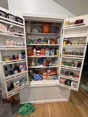 PANTRY: BEFORE & AFTER - This pantry was one of several transformations completed during an 8-hour kitchen, dining, and living space reset for a returning family. This husband-and-wife team was the perfect pair, working together to declutter foods their family no longer used or enjoyed. The Mack Master then checked expiration dates, categorized the remaining items, added simple clear bins and labels, and created an easy-to-maintain system. Teamwork + a simple system transformed this pantry in under 2 hours!