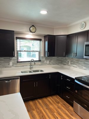 A backsplash for mom - This kitchen had been recently beautifully remodeled. The customer's son decided to gift her with a backsplash to put the icing on the cake. The glass mosaic tile has brushed nickel accents that really compliment the cabinet hardware and appliances and really brought everything together! A backsplash for mom - This kitchen had been recently beautifully remodeled. The customer's son decided to gift her with a backsplash to put the icing on the cake. The glass mosaic tile has brushed nickel accents that really compliment the cabinet hardware and appliances and really brought everything together!
