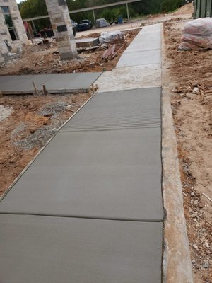 Sidewalk and walkways - This was a fun project we did for an apartment complex here in Austin. We did various walkways and several sidewalks for these brand new apartments. Sidewalk and walkways - This was a fun project we did for an apartment complex here in Austin. We did various walkways and several sidewalks for these brand new apartments.