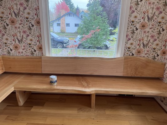 Custom Kitchen Seating Area - This was a fun project for a recent transplant to Eugene, that wanted to update the kitchen seating in her home and make it more inviting and cozy. We utilized custom douglas fir, live-edge logs harvested from the stock of a tree-cutting service in Springfield. With the timber, we cut, sanded, planed and sealed the lumber to build beautiful bench seating in the kitchen. Our customer, took the bench seating and created her own beautifully installed ornamentation to give the family meal gathering area a pop of color and femininity. She loved collaborating with us to bring her vision to life and shared in her 5-star Google Review: "I highly recommend Level and Plumb Construction for their creativity, vision, and professionalism!"