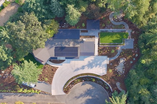Happy Valley Landscape Remodel - This remodel was done on a home in Happy Valley. The home was situated on a large hillside lot, most of which was grass on steeply sloping terrain. It was difficult to maintain and not very functional. The Owners wished to transform the landscape into a more functional layout and reduce maintenance. We developed a master plan for the site and worked with the Owner's to ensure all of their needs were met. This included a series of separate spaces with various functions, all while providing a cohesive feel and flow throughout the landscape. This included a series of retaining walls to terrace the lot, an attached patio cover along the rear of the house, a detached patio cover area with a spa, a rain garden, lawn areas for the dogs, a parking area for the RV trailer, as well fountains, plants and trees, and a landscape lighting system. Happy Valley Landscape Remodel - This remodel was done on a home in Happy Valley. The home was situated on a large hillside lot, most of which was grass on steeply sloping terrain. It was difficult to maintain and not very functional. The Owners wished to transform the landscape into a more functional layout and reduce maintenance. We developed a master plan for the site and worked with the Owner's to ensure all of their needs were met. This included a series of separate spaces with various functions, all while providing a cohesive feel and flow throughout the landscape. This included a series of retaining walls to terrace the lot, an attached patio cover along the rear of the house, a detached patio cover area with a spa, a rain garden, lawn areas for the dogs, a parking area for the RV trailer, as well fountains, plants and trees, and a landscape lighting system.