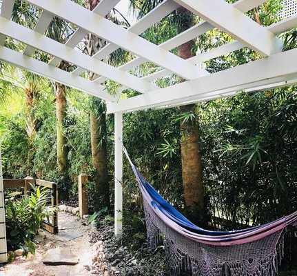 Pergola installation in garden/patio - We loved enhancing this client’s outdoor garden/patio area with this pergola designed for a hammock to nap in.