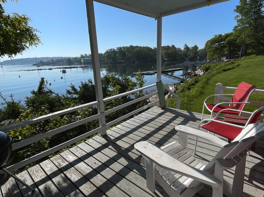 Shore Cottage - A cozy covered porch puts you right at the harbor’s edge! The Shore Cottage features a small bedroom with two twin beds, plus another two twin beds in the living room; altogether sleeps 4 (6 with the bunks). A “heatilator” fireplace takes the edge off those cool foggy days. The fully equipped kitchen includes a toaster, coffee maker, microwave, range and refrigerator. Linens and towels are provided, and extra supplies are on hand in the linen shed. Guests have access to the dock, tidal beach and other amenities, including a coin laundry. The Shore Cottage was built in 1948 and is approximately 472 square feet in area. Shore Cottage - A cozy covered porch puts you right at the harbor’s edge! The Shore Cottage features a small bedroom with two twin beds, plus another two twin beds in the living room; altogether sleeps 4 (6 with the bunks). A “heatilator” fireplace takes the edge off those cool foggy days. The fully equipped kitchen includes a toaster, coffee maker, microwave, range and refrigerator. Linens and towels are provided, and extra supplies are on hand in the linen shed. Guests have access to the dock, tidal beach and other amenities, including a coin laundry. The Shore Cottage was built in 1948 and is approximately 472 square feet in area.
