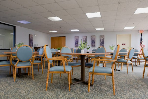 Freedom Village Senior Housing - Freedom Village consists of 198 units of senior housing in a three-story building. It is located in Homewood, Illinois in Cook County, 22 miles southwest of Chicago offering seniors an opportunity to enjoy all the comforts of home in a carefree environment. Freedom Village needed comfortable seating for its senior residents that could be used for dining and other activities that require sitting for long periods such as lectures, art classes or bingo night.
The retirement village has a large dining room where meals are served daily and is also used to host other events for the residents. The Louis aluminum arm chairs with padded seats and backs upholstered in light blue vinyl have a wood looking strong aluminum frame which combined with the wood table tops and light color scheme create a relaxing mood.
The Louis chairs are not your typical aluminum chairs. They feature a very realistic, natural looking, wood grain finish which comes in several wood finishes. This gives them an attractive, natural look which blends in with the decor helping to make the interior look more like a home than an institution. Also, the chairs’ stately looks and luxurious seat keep the residents comfortable while giving the room a refined look. The frames are extremely strong, yet lightweight making the chairs even lighter than wood chairs and durable for long term use and very easy to maintain.
The fully padded, deluxe chairs feature an extra wide seat for maximum comfort with the back and seat filled with high density foam ensuring long lasting durability. The chair’s back slightly reclines providing a more comfortable experience. In addition, the chairs come with armrests, which also assist the seniors in sitting down and getting up from their seats.
Clear glides allow ease of movement even on carpeting. There are different types of glides to choose from or you can opt for front casters which allow the elderly residents to easily move the chairs without lifting them. The chairs come with an optional hand hold or in a solid oval back. They can also be ordered with padded armrests. Freedom Village Senior Housing - Freedom Village consists of 198 units of senior housing in a three-story building. It is located in Homewood, Illinois in Cook County, 22 miles southwest of Chicago offering seniors an opportunity to enjoy all the comforts of home in a carefree environment. Freedom Village needed comfortable seating for its senior residents that could be used for dining and other activities that require sitting for long periods such as lectures, art classes or bingo night.
The retirement village has a large dining room where meals are served daily and is also used to host other events for the residents. The Louis aluminum arm chairs with padded seats and backs upholstered in light blue vinyl have a wood looking strong aluminum frame which combined with the wood table tops and light color scheme create a relaxing mood.
The Louis chairs are not your typical aluminum chairs. They feature a very realistic, natural looking, wood grain finish which comes in several wood finishes. This gives them an attractive, natural look which blends in with the decor helping to make the interior look more like a home than an institution. Also, the chairs’ stately looks and luxurious seat keep the residents comfortable while giving the room a refined look. The frames are extremely strong, yet lightweight making the chairs even lighter than wood chairs and durable for long term use and very easy to maintain.
The fully padded, deluxe chairs feature an extra wide seat for maximum comfort with the back and seat filled with high density foam ensuring long lasting durability. The chair’s back slightly reclines providing a more comfortable experience. In addition, the chairs come with armrests, which also assist the seniors in sitting down and getting up from their seats.
Clear glides allow ease of movement even on carpeting. There are different types of glides to choose from or you can opt for front casters which allow the elderly residents to easily move the chairs without lifting them. The chairs come with an optional hand hold or in a solid oval back. They can also be ordered with padded armrests.