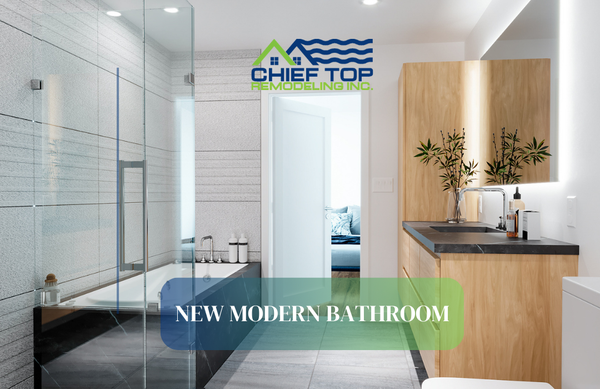 Studio City- New modern bathroom - A luxurious and modern bathroom with a wood vanity, black countertop, backlit mirror, and minimalist decor. Features include a glass-enclosed shower with pebble flooring, a black marble-framed soaking tub, textured gray tiles, and recessed lighting for a sleek, spa-like feel.