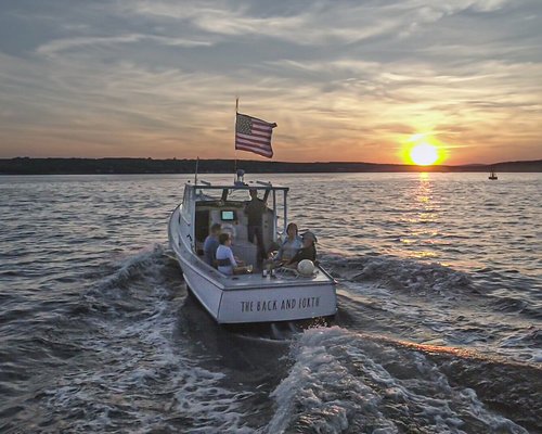 Breathtaking Sunset Cruise & Lobster! Available June 1st - October 15th - This is a VIP Sunset Cruise with a stop off at Young's Lobster pound, your cruise will be aboard a
traditional 1959 wooden lobster boat that has been restored to its full glory.
Our Captains are knowledgeable, fun and friendly and all of our guests have rated the experience 5 star.
More Details...
You will find your Captain down at the Belfast City Harbor Dock aboard the Back and Forth, a traditional 28ft wooden lobster boat, the perfect iconic vessel to take a Sunset cruise in Mid-Coast Maine.
Bring along your beverage of choice and relax in one of the captains chairs as we take a short tour around Belfast harbor where we can chat about Belfast and it's activities.
We will cruise over to Young's lobster pound, tie up and the captain will take you into one of Maine's most iconic Lobster pounds. It gets extremely busy, so an order of lobster rolls will be waiting for us. But there is no rush, take time to check out the lobster tanks, take some pictures and just soak up the energy of the place.
Back down on the boat, we will cruise out into the bay. You can bask in the serenity, take photos, drink, eat and we can chat about everything or nothing.
The Captains have endless stories about Belfast, from great whites to the gigantic sunfish spotted last season and even stories of hidden treasure out on one of the 200 islands of Penobscot Bay. Your Captain will get you out to a perfect spot where you can drift gently and take it all in.
The whole trip will take about 2 hours and will get you back just after sunset. Breathtaking Sunset Cruise & Lobster! Available June 1st - October 15th - This is a VIP Sunset Cruise with a stop off at Young's Lobster pound, your cruise will be aboard a
traditional 1959 wooden lobster boat that has been restored to its full glory.
Our Captains are knowledgeable, fun and friendly and all of our guests have rated the experience 5 star.
More Details...
You will find your Captain down at the Belfast City Harbor Dock aboard the Back and Forth, a traditional 28ft wooden lobster boat, the perfect iconic vessel to take a Sunset cruise in Mid-Coast Maine.
Bring along your beverage of choice and relax in one of the captains chairs as we take a short tour around Belfast harbor where we can chat about Belfast and it's activities.
We will cruise over to Young's lobster pound, tie up and the captain will take you into one of Maine's most iconic Lobster pounds. It gets extremely busy, so an order of lobster rolls will be waiting for us. But there is no rush, take time to check out the lobster tanks, take some pictures and just soak up the energy of the place.
Back down on the boat, we will cruise out into the bay. You can bask in the serenity, take photos, drink, eat and we can chat about everything or nothing.
The Captains have endless stories about Belfast, from great whites to the gigantic sunfish spotted last season and even stories of hidden treasure out on one of the 200 islands of Penobscot Bay. Your Captain will get you out to a perfect spot where you can drift gently and take it all in.
The whole trip will take about 2 hours and will get you back just after sunset.