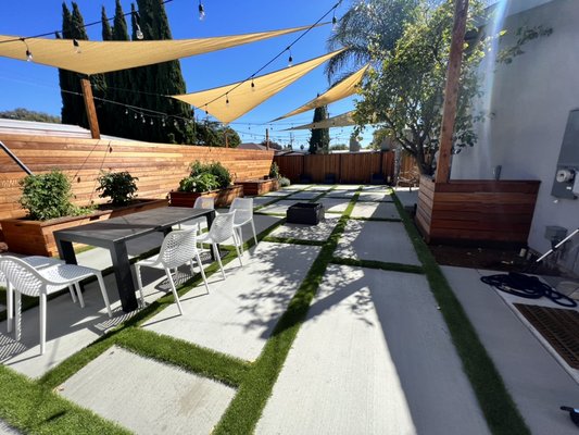 Santa Clara, Ca - Beautiful modern landscape project in Sara Clara, CA. Poured in place concrete pads with decorative pebbles, Gold fines path ways, custom wood vegetable boxes. Our main goal was to have a functional and useful space in the landscape.