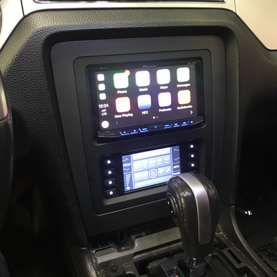 Mustang Install - Full audio overhaul featuring a modern touchscreen head unit, high-performance amplifiers, and custom speaker setup. Integrated digital dash conversion with full OBD-II functionality. All OEM controls retained — professionally tuned for clarity, balance, and power.