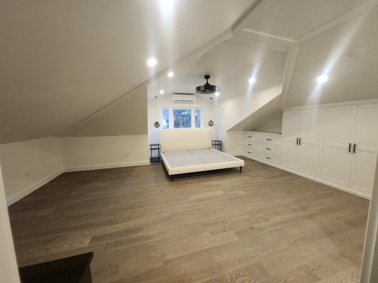 Attic Conversion - The previously unusable, dark, and cramped attic has been fully transformed into a bright, conditioned, and spacious upper-level retreat. Two new dormers were added to introduce abundant natural light and headroom, while a dedicated split-system HVAC ensures year-round comfort. The existing bathroom was redesigned and reorganized for better flow and modern efficiency, complemented by new flooring throughout. Custom built-in closets maximize storage, creating a versatile, light-filled space ideal for a home office, guest suite, or private sanctuary.