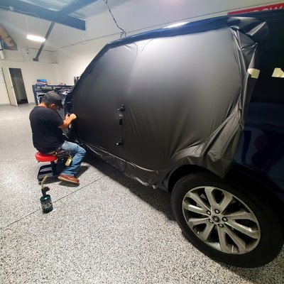 Vehicle wrapping work - Full color change on this Range Rover with door jams