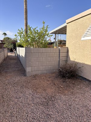 New Block Wall Installation - For this project, we built a brand-new block wall from the ground up, adding strength and privacy to the property. We also took the time to clean up the surrounding area, giving it a fresh, neat look. Every block was placed with care, creating a clean and durable finish that’ll last for years. New Block Wall Installation - For this project, we built a brand-new block wall from the ground up, adding strength and privacy to the property. We also took the time to clean up the surrounding area, giving it a fresh, neat look. Every block was placed with care, creating a clean and durable finish that’ll last for years.