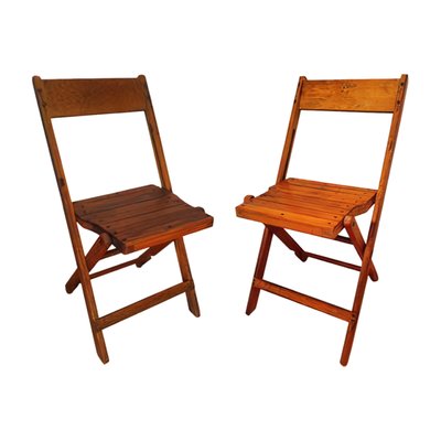 Vintage Folding Chairs - These are the original wooden folding chairs you’ve been searching for — restored and ready to bring vintage charm to your next event. Their iconic style complements a range of settings, from modern to industrial, rustic to formal. Available in honey maple and dark oak, with several hundred in stock. Vintage Folding Chairs - These are the original wooden folding chairs you’ve been searching for — restored and ready to bring vintage charm to your next event. Their iconic style complements a range of settings, from modern to industrial, rustic to formal. Available in honey maple and dark oak, with several hundred in stock.
