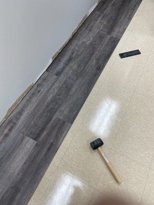 Commercial office. Laminate flooring and painting.(Monroe,NJ) - Small commercial office kitchen remodel. We came in and patched walls, primed and painted room all new color. Removed old rubber base and installed all new laminate flooring and base.