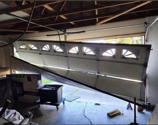 Door Off Track - Examples of garage doors that have come off track due to damaged rollers, loose cables, or impact. CLE Garage Doors safely realigns the door, repairs the affected components, and restores smooth, dependable operation.