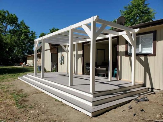 Deck and Pergola build - This is an 16x8 foot deck with an exclusive "minimalist" pergola exclusive to Denver Remodels. The pergola was designed with shade sails in mind as well as an optional swing or hammock. On this project we replaced the wooden deck and used Trex decking.