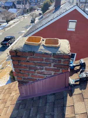 Multi Flue Chimney Cap Installation - On windy days, it's especially important to ensure all your chimney flues are capped, not only to prevent unwanted hazards from entering the chimney, but also to prevent sparks from escaping and causing roof fires. It will also prevent outside elements and animals from entering your home and causing damage to your flue. Multi Flue Chimney Cap Installation - On windy days, it's especially important to ensure all your chimney flues are capped, not only to prevent unwanted hazards from entering the chimney, but also to prevent sparks from escaping and causing roof fires. It will also prevent outside elements and animals from entering your home and causing damage to your flue.