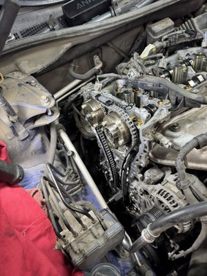 Timing Chain Replacements - All cars that are gas powered have a timing chain or timing belt. The difference being a belt is quieter, cheaper, and must be replaced on a schedule (usually about every 110K miles). A chain is louder, more durable, and usually lasts the life of the engine. Although very rare, sometimes the timing chain gets stretched and may need to be replaced. Replacing the timing belt/chain is critical because if it fails, the engine instantly loses synchronization — causing catastrophic internal damage on most modern interference engines. A worn belt can snap without warning, and a stretched chain can jump timing, both leading to bent valves, damaged pistons, or a completely destroyed engine. We recently replaced a stretched chain on high mileage Camry. No worries though! We replaced the chain, tensioners, and guides; put it all back together and it's great again! Timing Chain Replacements - All cars that are gas powered have a timing chain or timing belt. The difference being a belt is quieter, cheaper, and must be replaced on a schedule (usually about every 110K miles). A chain is louder, more durable, and usually lasts the life of the engine. Although very rare, sometimes the timing chain gets stretched and may need to be replaced. Replacing the timing belt/chain is critical because if it fails, the engine instantly loses synchronization — causing catastrophic internal damage on most modern interference engines. A worn belt can snap without warning, and a stretched chain can jump timing, both leading to bent valves, damaged pistons, or a completely destroyed engine. We recently replaced a stretched chain on high mileage Camry. No worries though! We replaced the chain, tensioners, and guides; put it all back together and it's great again!