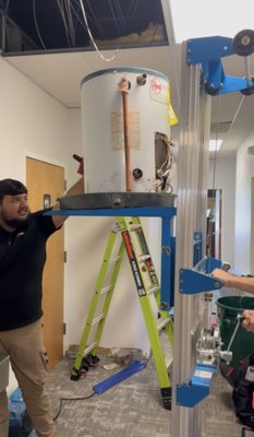 Emergency Plumbing Repair - Our team was called to inspect a ceiling leak in a commercial space. Upon investigation, we discovered that the source of the leak was a failing Rheem water heater mounted above the ceiling. The tank had significant corrosion and was leaking from multiple points, creating water damage risks to the ceiling and surrounding area.
Plan:
To ensure safety and minimize disruption, our technicians developed a step-by-step plan that included:
Power and water shutoff to isolate the damaged unit.
Inspection of drain pan, pressure relief valve, and supply lines.
Coordinating the safe removal of the ceiling-mounted water heater using a lift system.
Preparation for installation of a new high-efficiency replacement unit.
Solution:
The damaged Rheem unit was safely removed using professional lift equipment to avoid structural damage. A new, energy-efficient water heater was installed with upgraded fittings, new isolation valves, and a properly sloped drain line to prevent future leaks. The system was tested for leaks and performance, ensuring reliable hot water and a watertight installation.
🏡 SwiftPro — Your local family-owned HVAC & plumbing experts, serving Northern Virginia with safe, precise, and lasting solutions. Emergency Plumbing Repair - Our team was called to inspect a ceiling leak in a commercial space. Upon investigation, we discovered that the source of the leak was a failing Rheem water heater mounted above the ceiling. The tank had significant corrosion and was leaking from multiple points, creating water damage risks to the ceiling and surrounding area.
Plan:
To ensure safety and minimize disruption, our technicians developed a step-by-step plan that included:
Power and water shutoff to isolate the damaged unit.
Inspection of drain pan, pressure relief valve, and supply lines.
Coordinating the safe removal of the ceiling-mounted water heater using a lift system.
Preparation for installation of a new high-efficiency replacement unit.
Solution:
The damaged Rheem unit was safely removed using professional lift equipment to avoid structural damage. A new, energy-efficient water heater was installed with upgraded fittings, new isolation valves, and a properly sloped drain line to prevent future leaks. The system was tested for leaks and performance, ensuring reliable hot water and a watertight installation.
🏡 SwiftPro — Your local family-owned HVAC & plumbing experts, serving Northern Virginia with safe, precise, and lasting solutions.