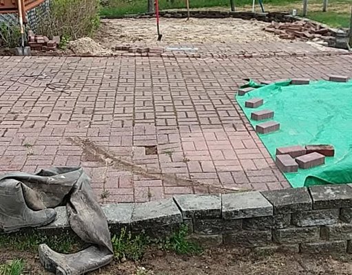 Clam lake - This is the project that we were called to take a look at to renew his existing seawall retaining wall and patio we got there and the whole place was holding water we rerouted the water we built the seawall and refreshed existing patio areas